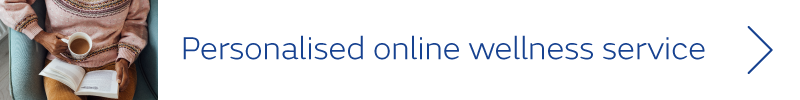 Person sat with book and coffee - text: Personalised online wellness service